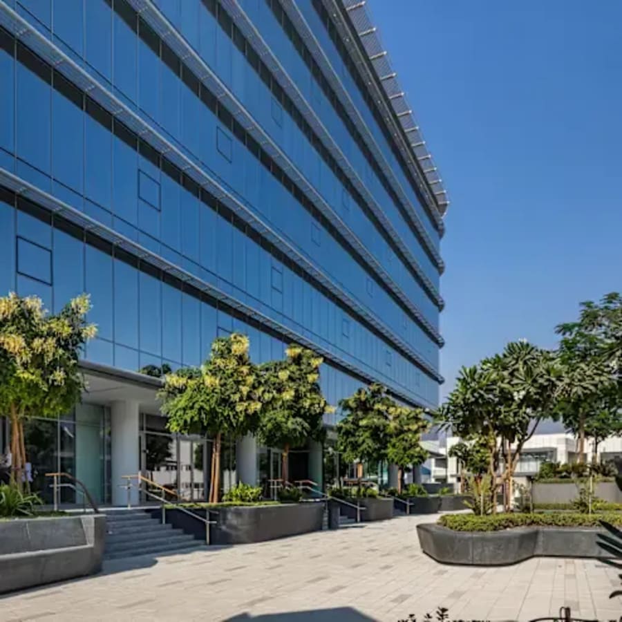 Modern coworking space with lush landscaping in Dubai's prime location. Ideal for dynamic teams.