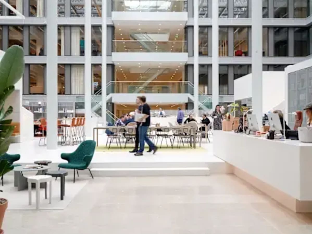 Bright coworking space in Dubai Media City with modern seating and ample natural light.