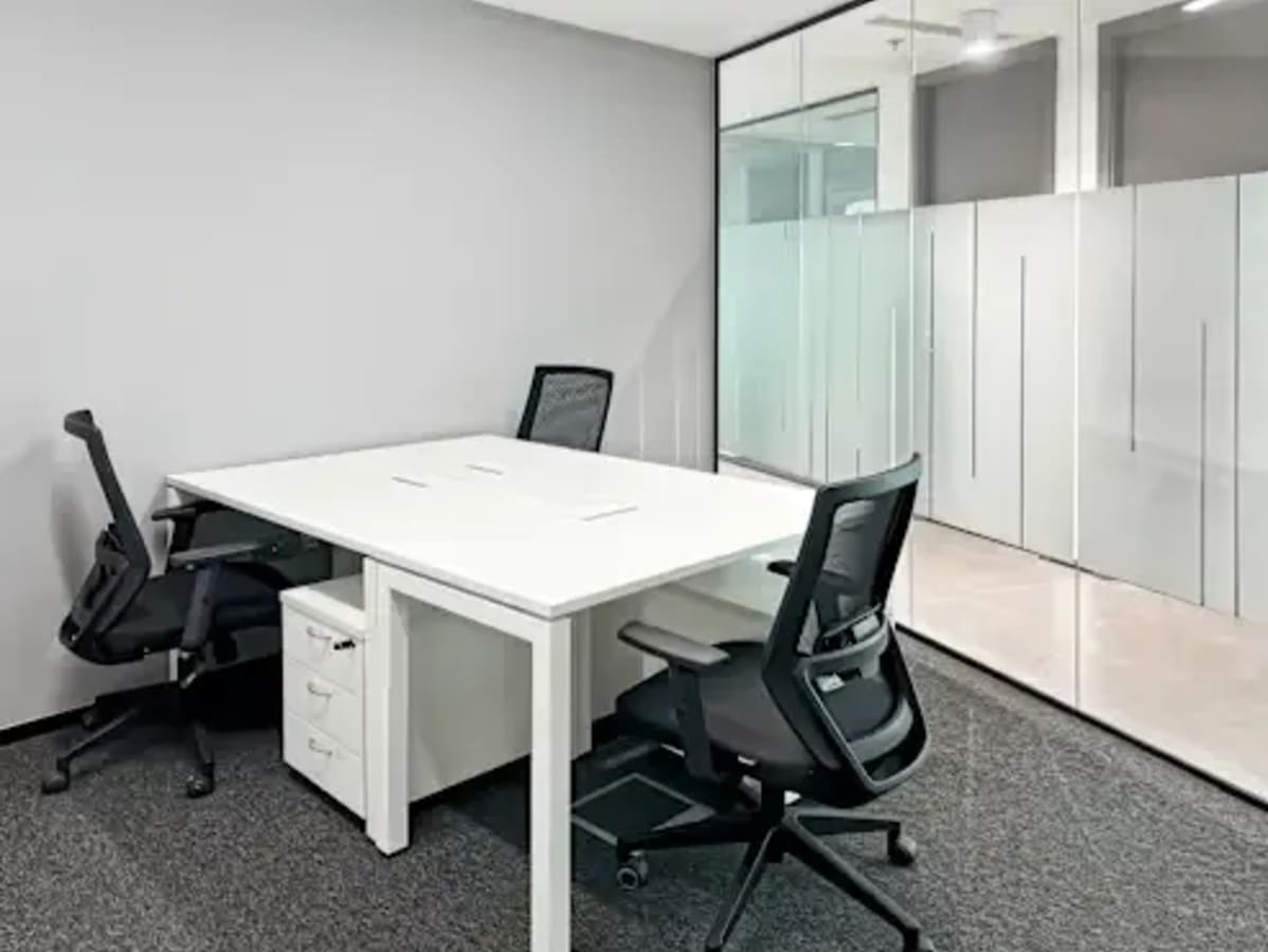 Modern coworking space with sleek desks and ergonomic chairs in DMCC Free Zone.
