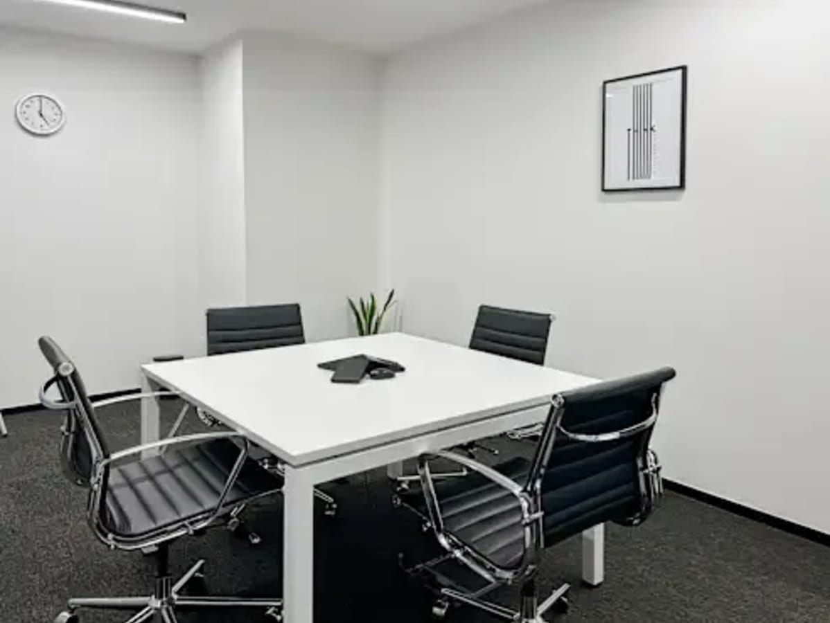 Sleek meeting room with modern furnishings and minimalist decor in DMCC Free Zone coworking space.