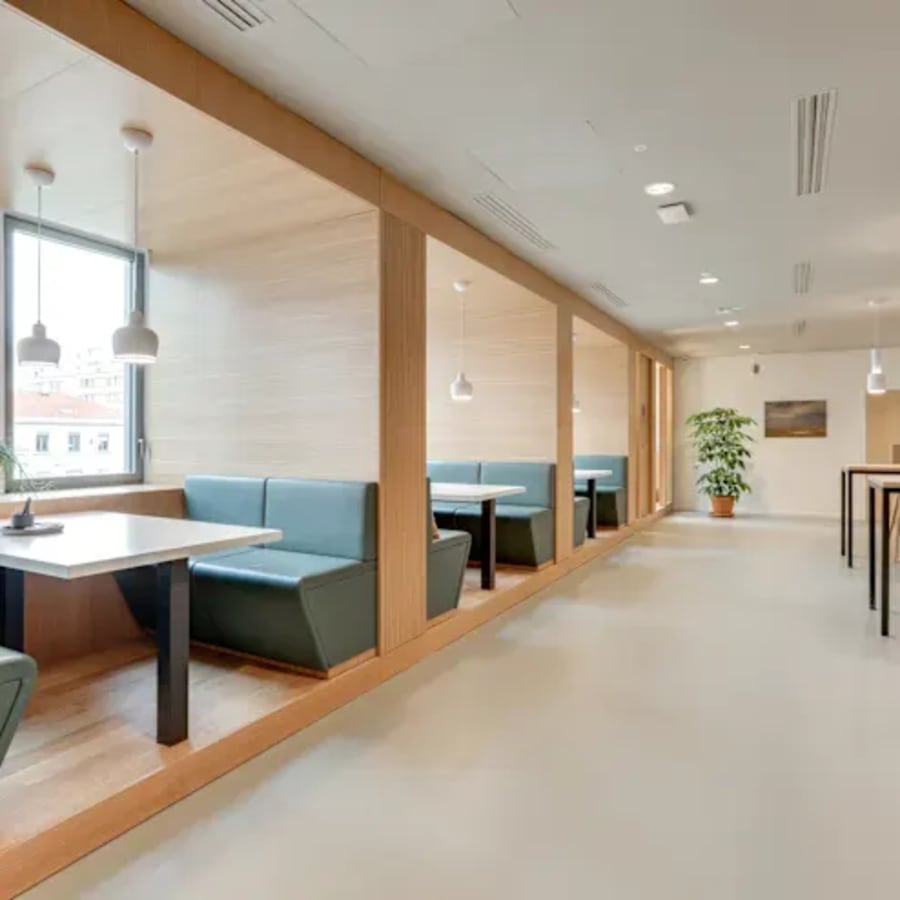 Stylish coworking booths with natural light and modern decor in Barsha Heights. Perfect for meetings.