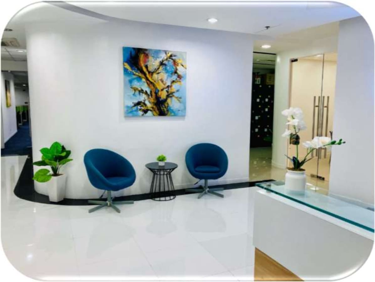 Modern coworking lounge with stylish chairs, vibrant art, and sleek decor on Kalayaan Avenue.