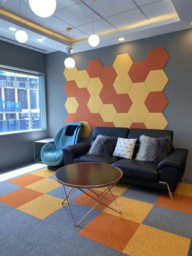 Modern coworking lounge with vibrant decor and cozy seating, perfect for creativity and networking.