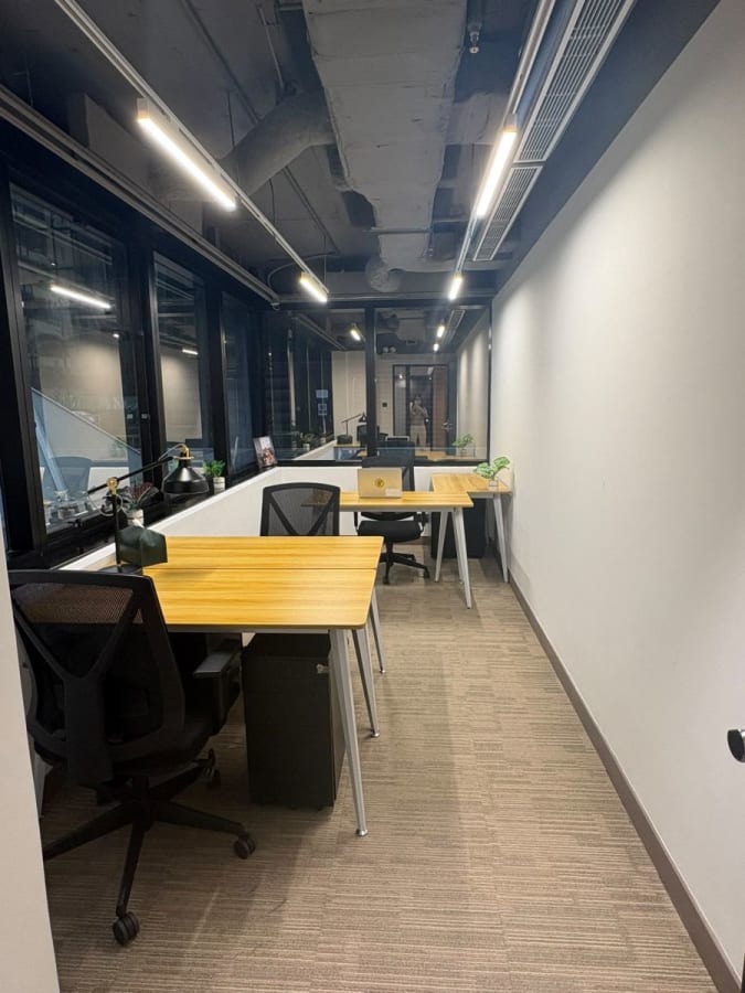 Bright, modern coworking space with ergonomic chairs and natural light in Hong Kong Island.