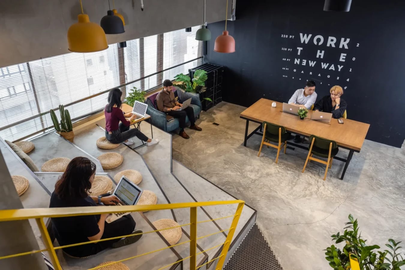 Modern coworking space with open seating, natural light, and creative design. Perfect for collaboration.