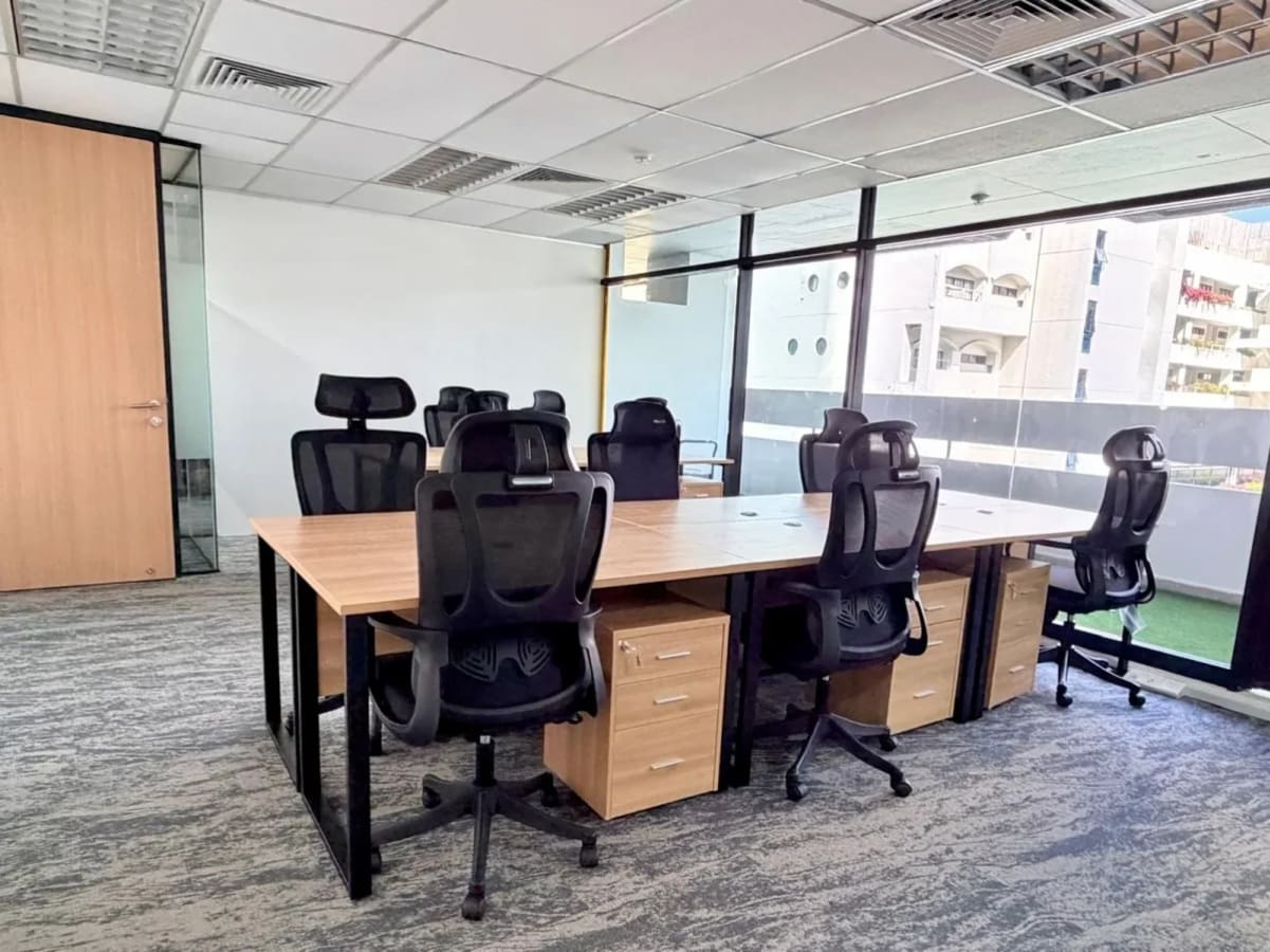 Bright, modern coworking space with ergonomic chairs and large windows on Orchard Road.