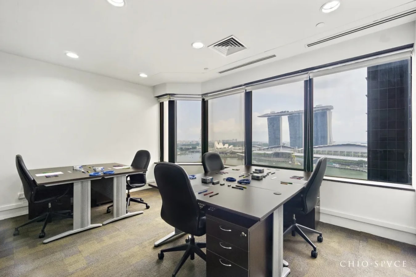 Bright coworking space with stunning views of Marina Bay. Ideal for collaboration and productivity.