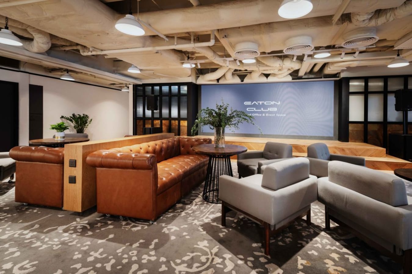 Chic coworking space with plush seating and elegant decor on Garden Road. Ideal for collaboration.