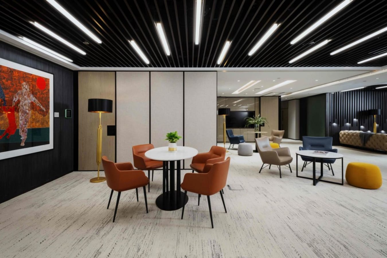 Sleek coworking space with modern furniture and vibrant seating. Ideal for collaboration and creativity.