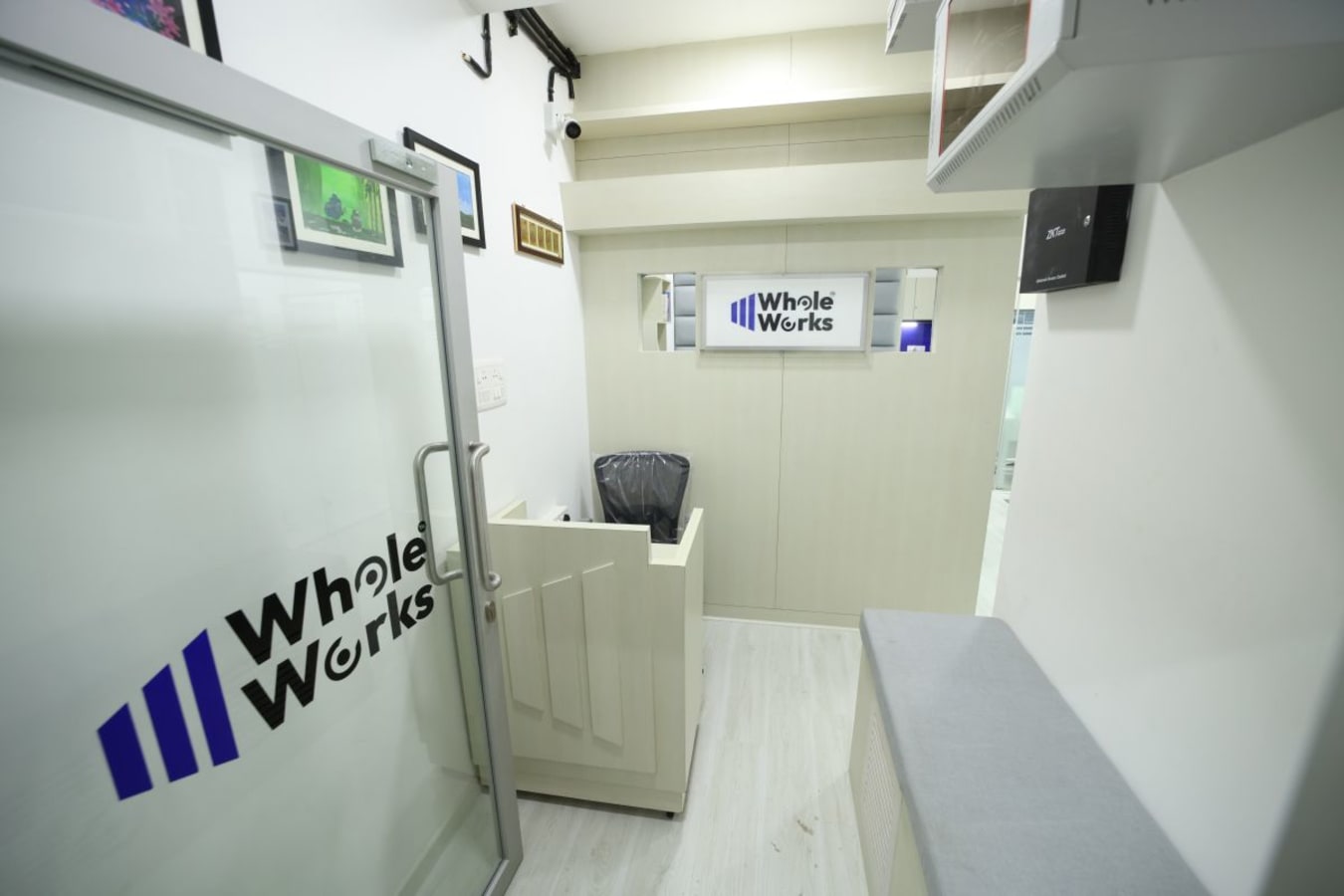 Modern coworking entry with sleek glass door and minimalist design. Ideal for productivity.