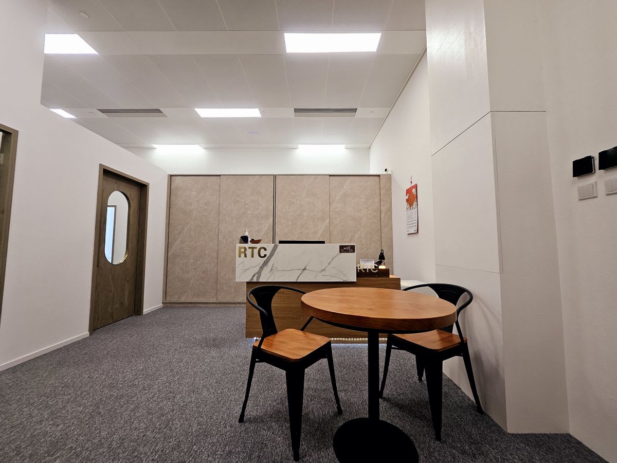 Modern coworking space with sleek furniture and ample lighting on Wang Chiu Road.