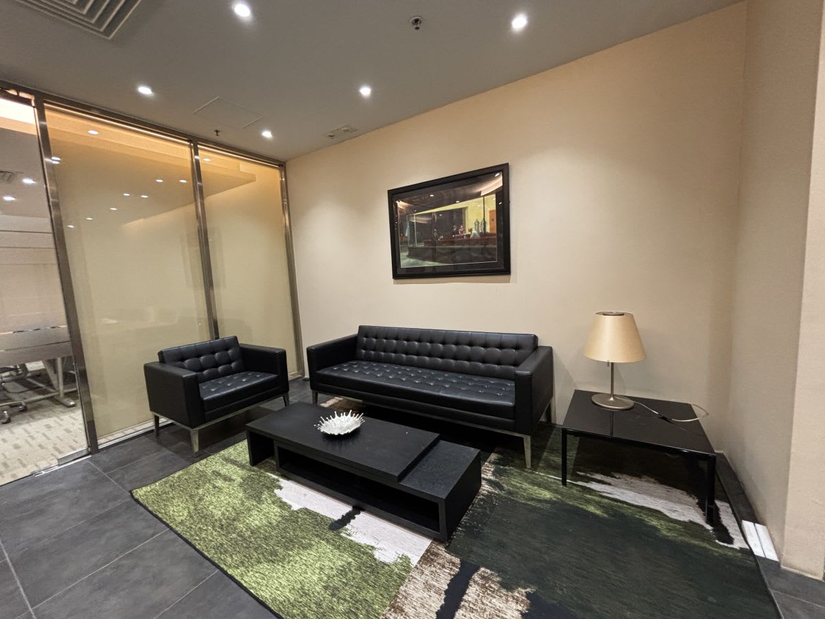 Stylish coworking lounge with plush seating and modern decor on Kwun Tong Road.