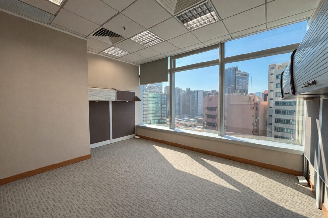 Bright, spacious coworking space with expansive city views in Kwun Tong Road, Kowloon.
