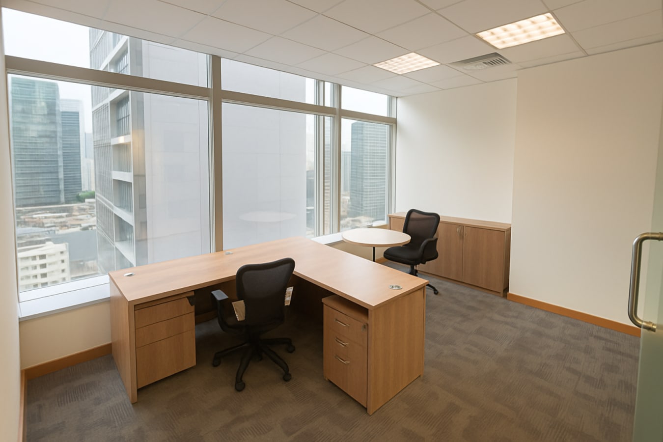 Bright corner office with large windows and modern furniture in Kwun Tong's coworking space.