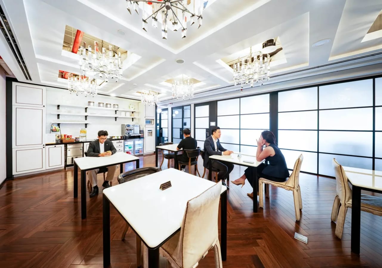 Elegant coworking space with natural light, sleek tables, and modern amenities in Ho Chi Minh City.