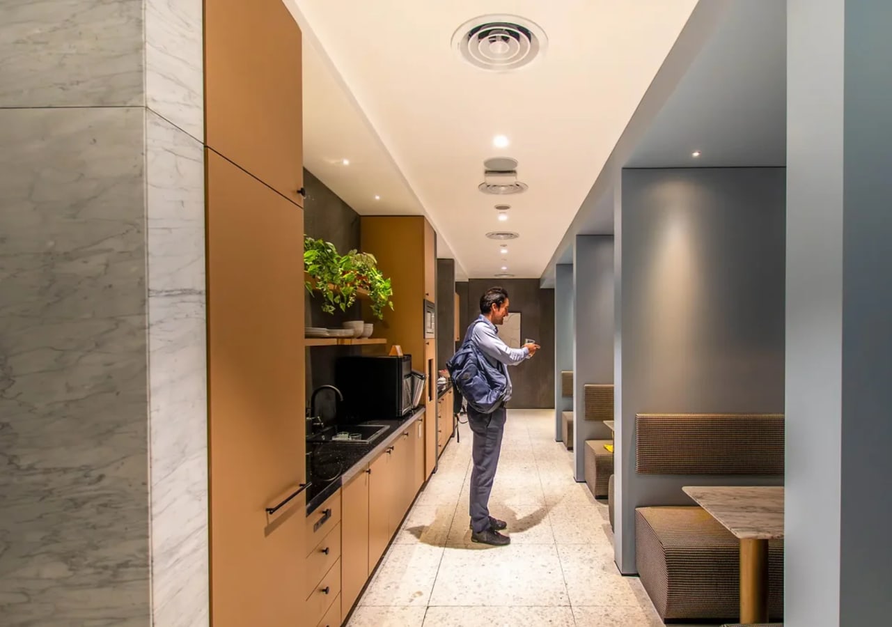 Sleek kitchenette and cozy seating areas, perfect for breaks and informal meetings.