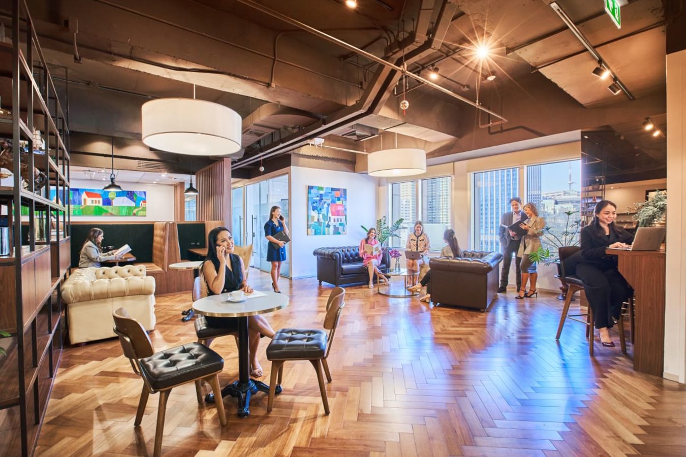 Stylish coworking space in Pathumwan with modern seating, natural light, and vibrant decor.