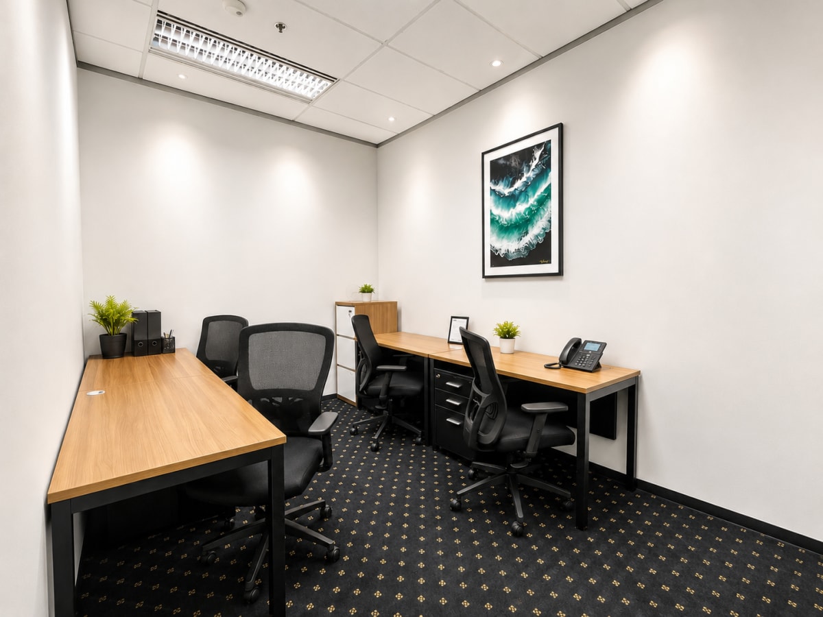 Modern coworking space with sleek desks, ergonomic chairs, and natural decor in Pathumwan.