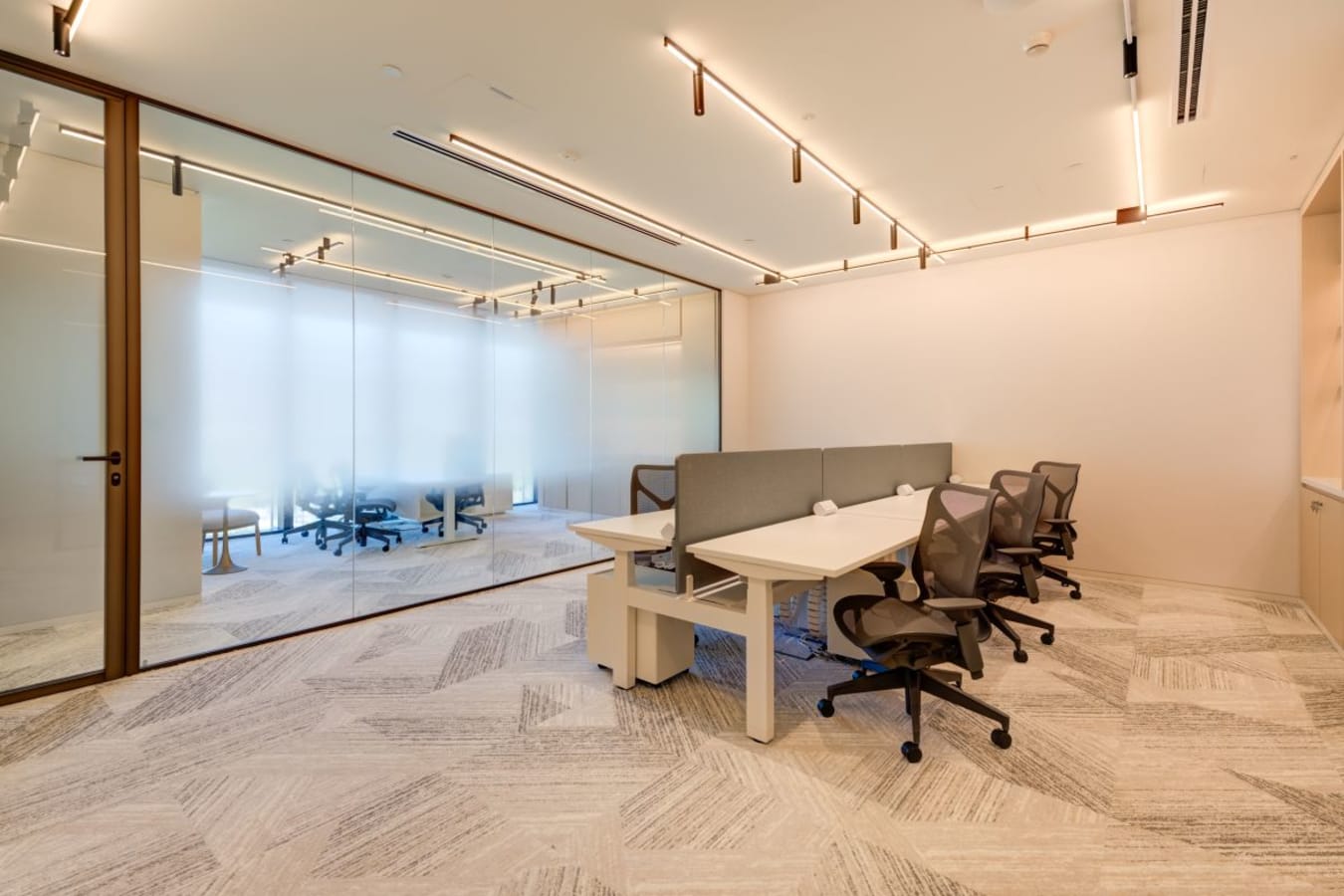 Modern coworking space with sleek workstations and glass partitions in Za’abeel 1, Dubai.