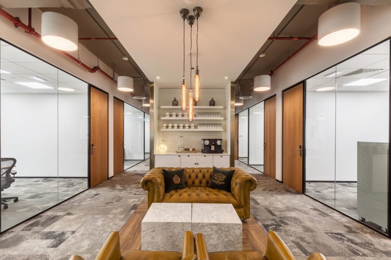 Stylish coworking space with plush seating and modern amenities on Sheikh Zayed Road, Dubai.