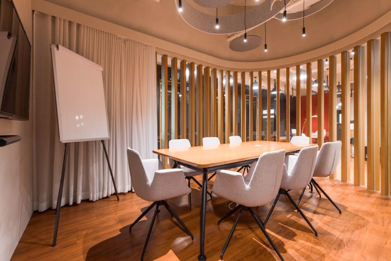 Modern conference room with sleek table, ergonomic chairs, and ambient lighting in Causeway Bay.