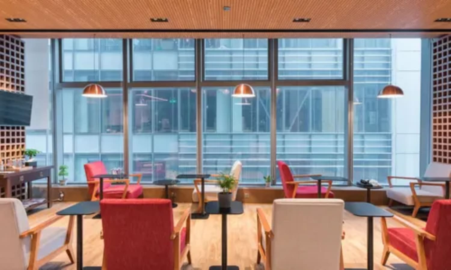 Modern coworking area in Causeway Bay with ample natural light and stylish seating.