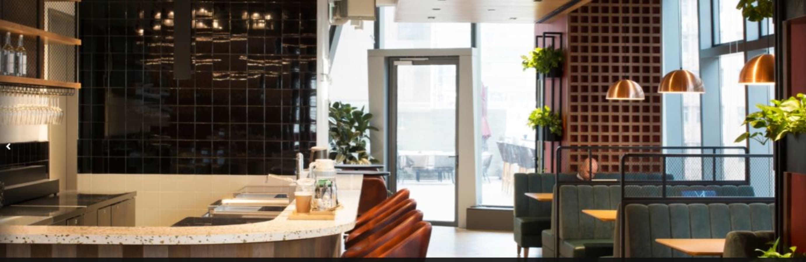 Stylish coworking space in Causeway Bay. Modern seating, natural light, and inviting decor.