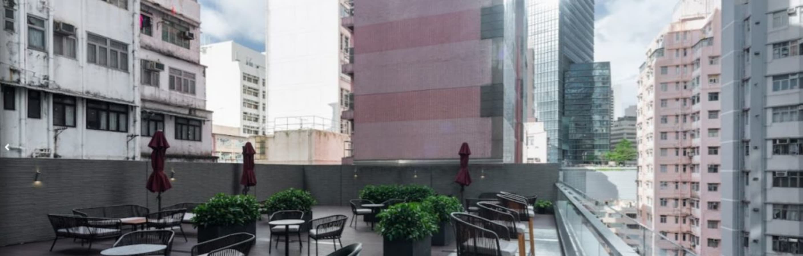 Rooftop terrace with seating and greenery—ideal for casual meetings in Causeway Bay.