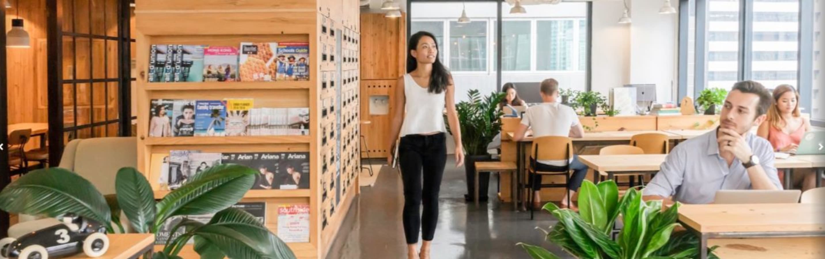 Bright coworking space with modern decor, lush greenery, and ample natural light on Luard Road.