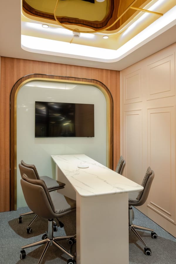 Sleek Hong Kong coworking space with modern meeting area and high-end finishes.