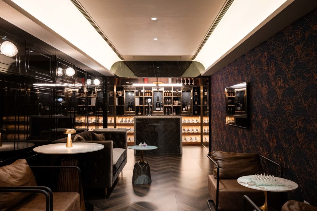 Sophisticated lounge with chic decor, plush seating, and ambient lighting in Central Hong Kong coworking space.