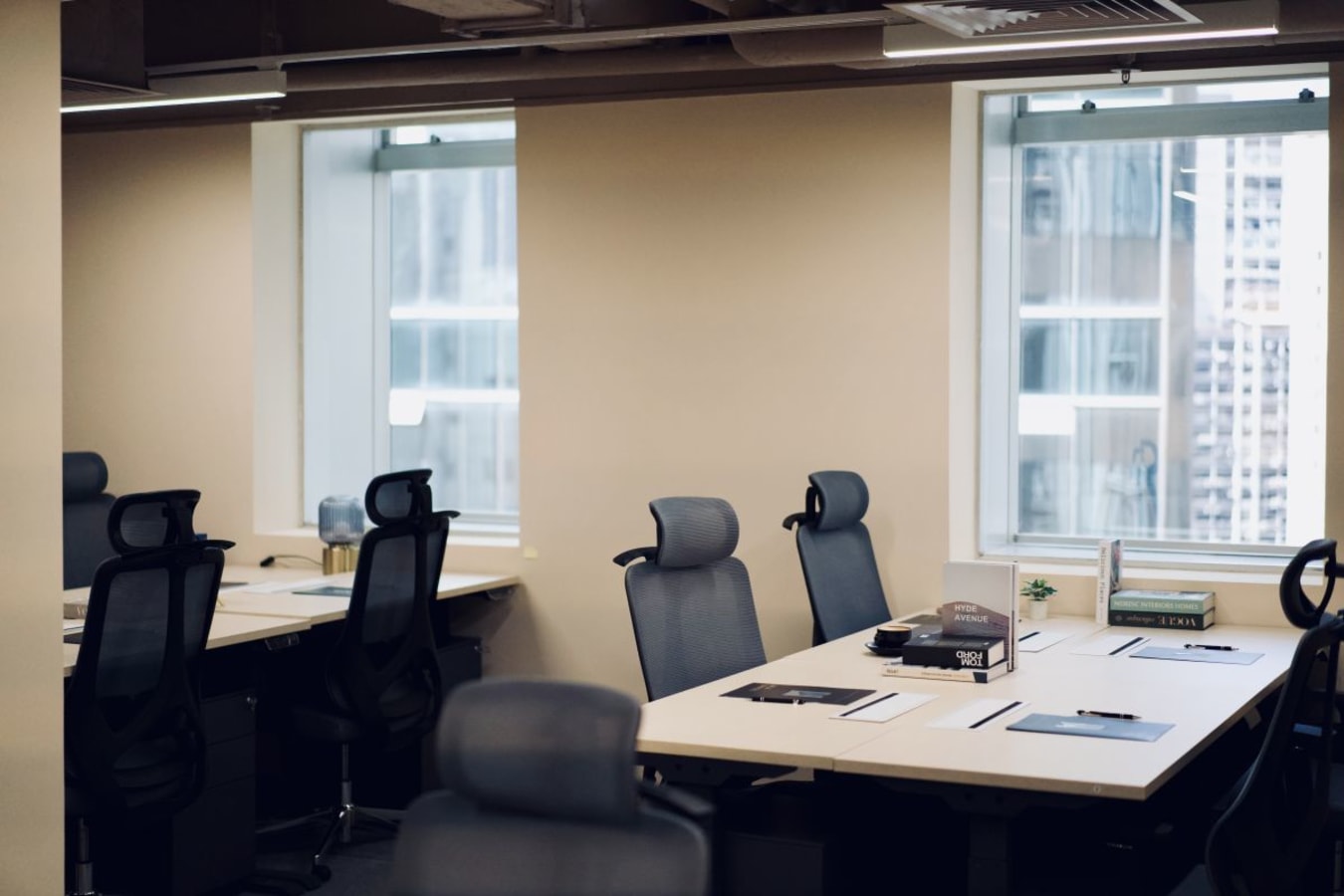 Modern coworking space with ergonomic chairs and ample natural light in Central Hong Kong.