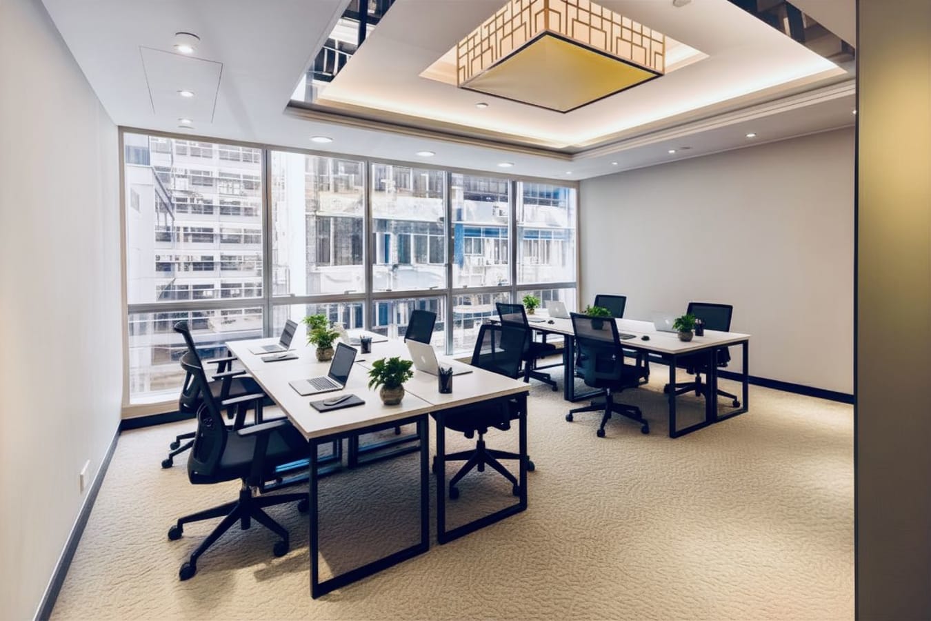 Bright coworking space with modern desks, ergonomic chairs, and natural light in Tsim Sha Tsui.