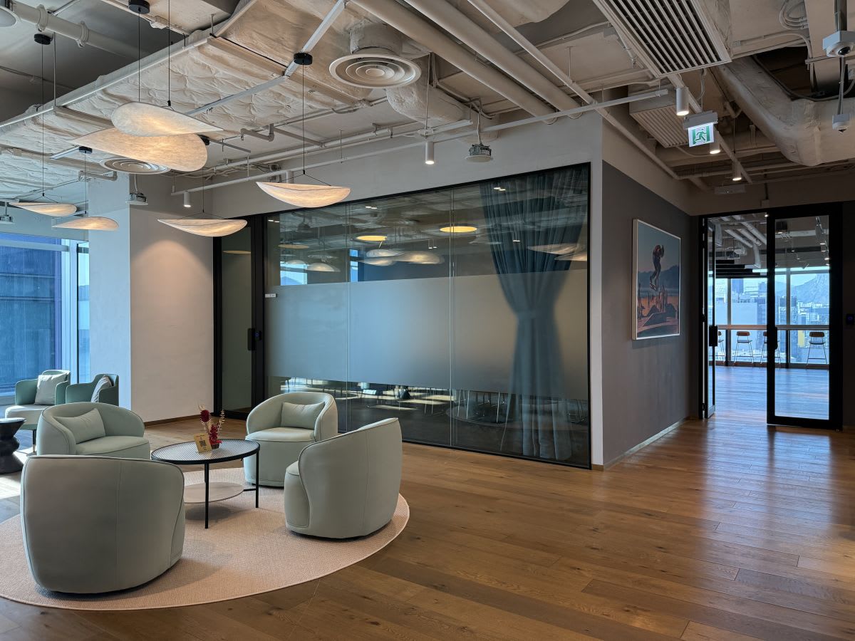 Modern coworking space with cozy seating and stylish lighting. Perfect for collaboration.