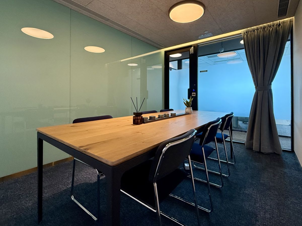 Modern coworking space with stylish table, comfy chairs, and soft lighting in Kwun Tong.