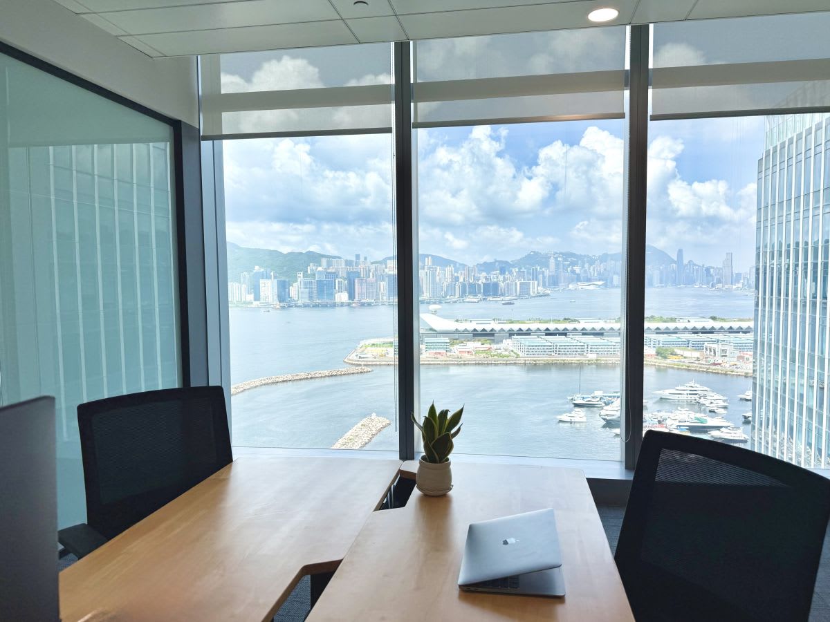 Bright coworking space with stunning harbor views and modern furnishings in Kwun Tong.