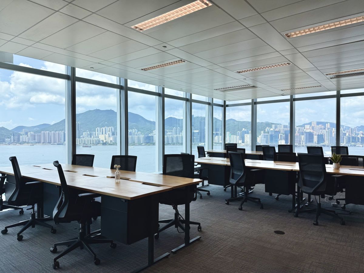 Bright coworking space with stunning ocean views, modern desks, and ergonomic chairs in Kwun Tong.