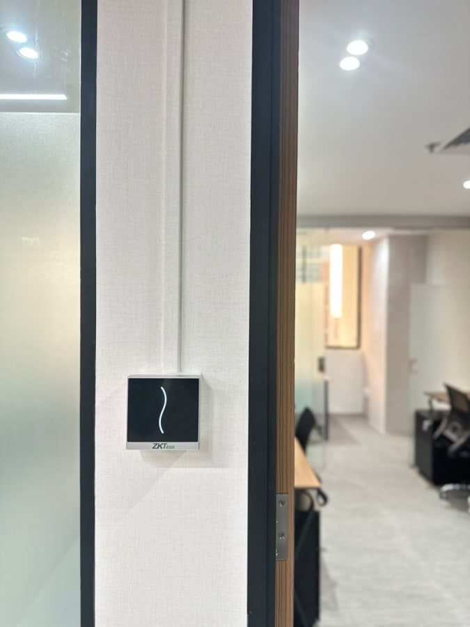 Modern coworking space with secure entry and sleek furnishings in Anson Road, Singapore.