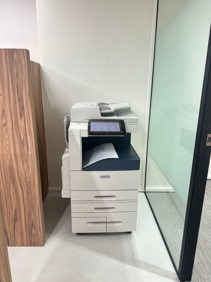 Modern office copier in a sleek workspace on Anson Road. Perfect for all your printing needs.