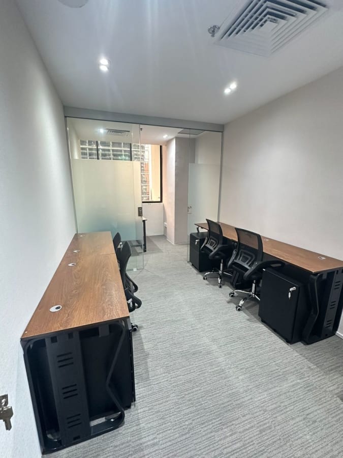 Modern, sleek coworking space with natural light and ergonomic chairs on Anson Road.