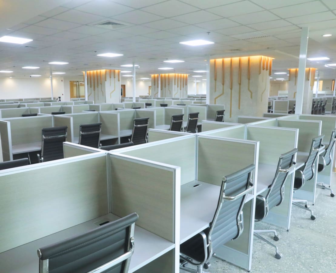 Spacious modern coworking area with individual workstations and ample lighting in Salinas Drive.
