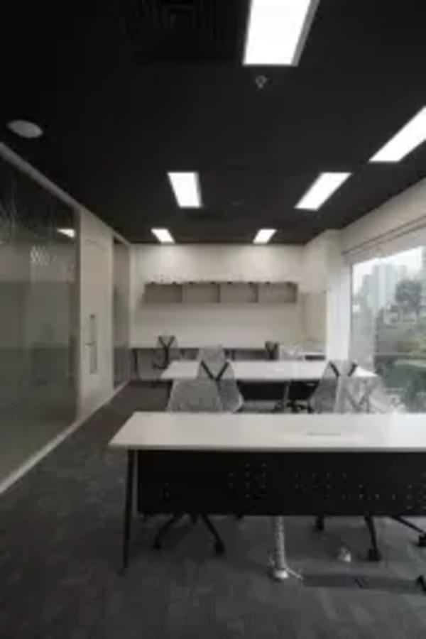 Bright, modern coworking space with ample seating and natural light on Clemenceau Avenue.