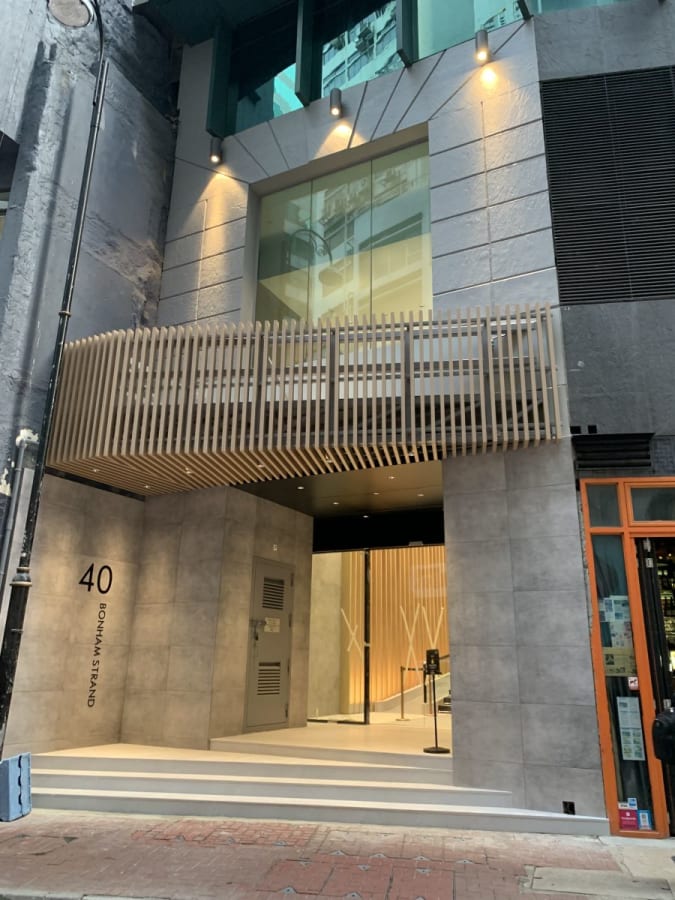 Modern coworking entry in Sheung Wan with sleek design and inviting ambiance.