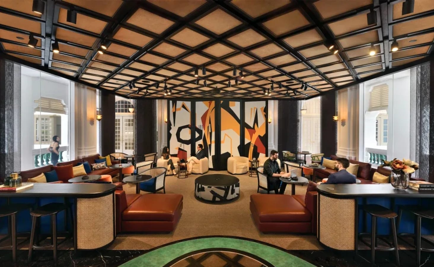 Stylish coworking space with modern decor, ample seating, and abundant natural light in Singapore.