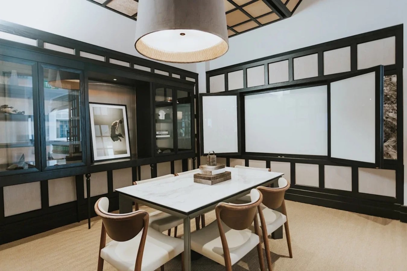 Elegant meeting space with modern design, ample natural light, and contemporary furniture. Perfect for collaboration.