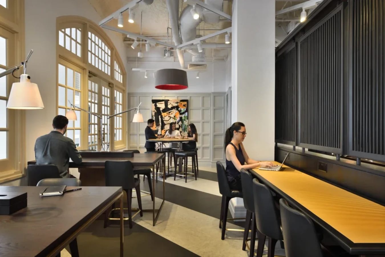 Bright, modern coworking space with collaborative and individual work areas. Ideal for productivity.