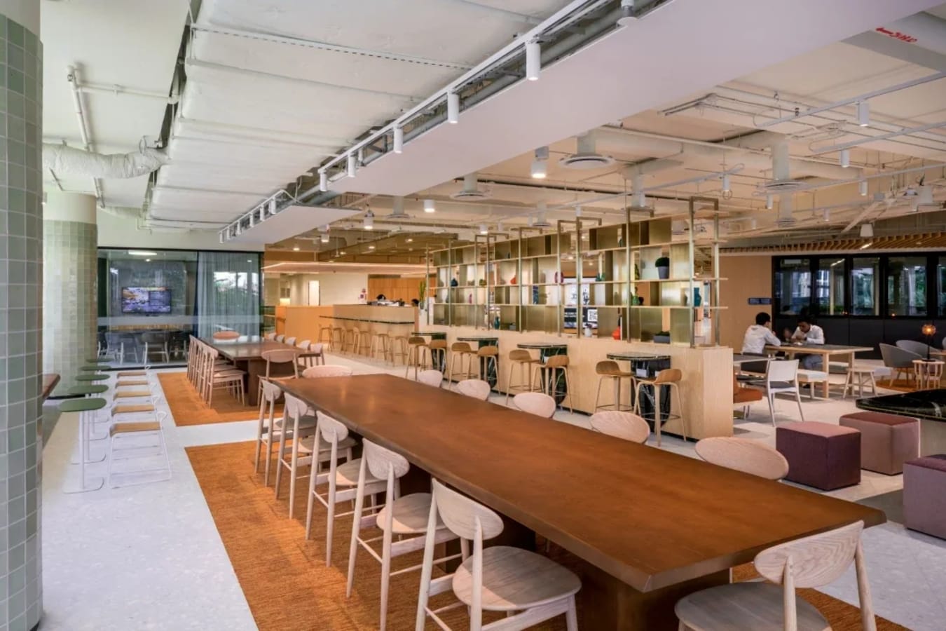 Modern coworking space with open layout, ample seating, and stylish decor in Singapore.