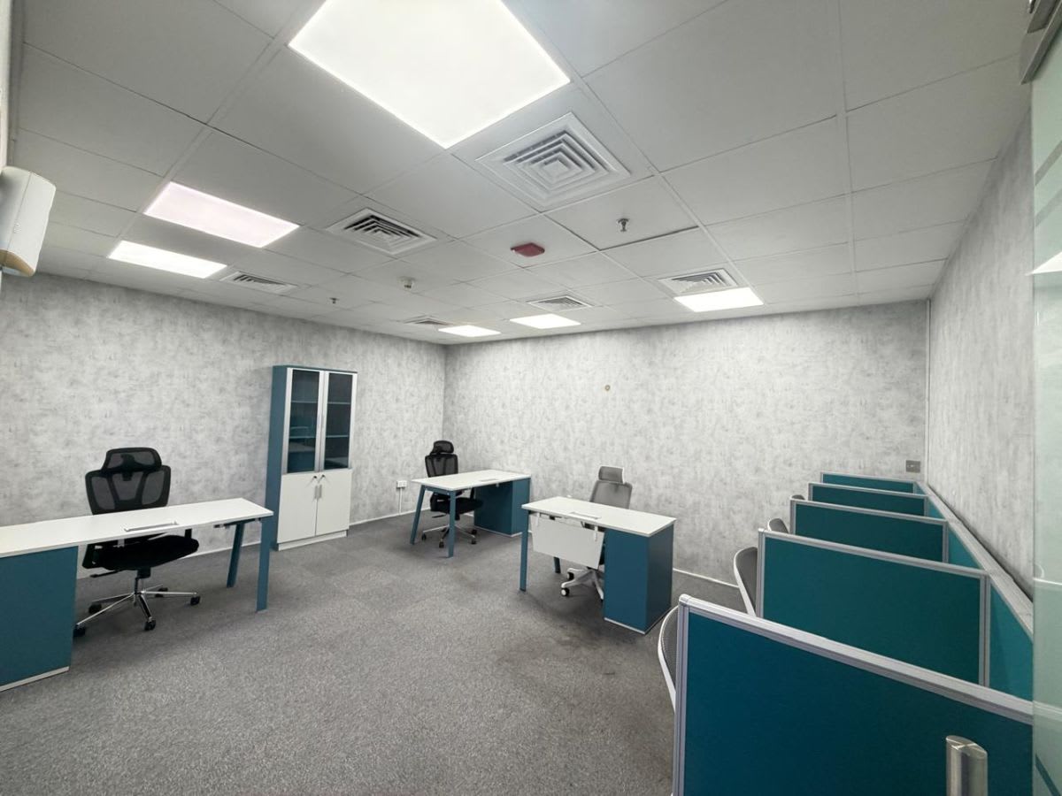 Modern coworking space with ergonomic chairs and ample natural light on Marasi Drive, Dubai.