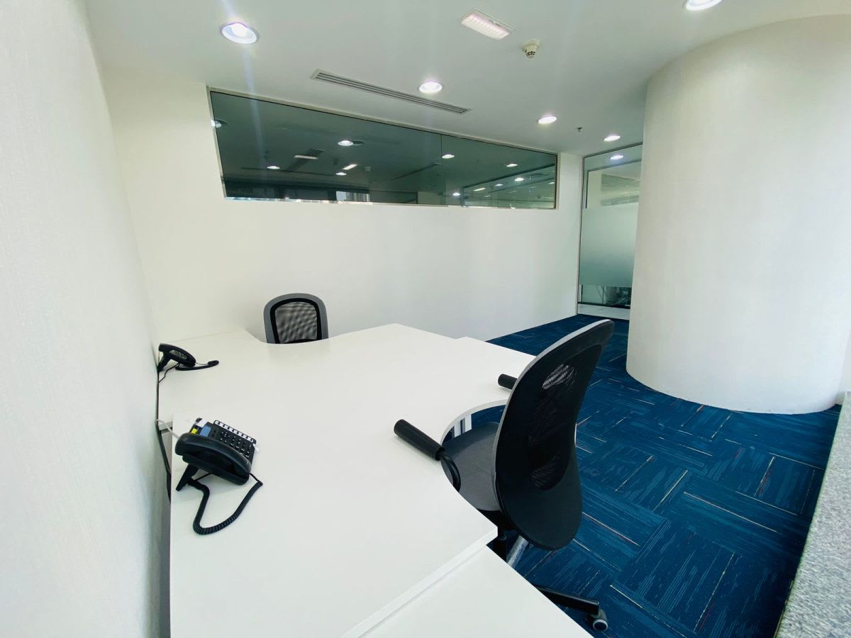 Sleek, modern workspace with glass partitions and ergonomic seating in Marasi Drive, Dubai.