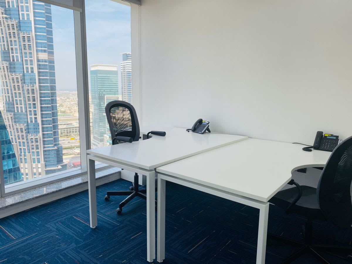 Bright workspace with city views, ergonomic chairs, and modern desks in Marasi Drive, Dubai.